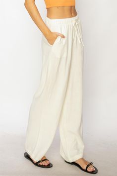 Unleash your inner wanderlust with our Mediterranean Stroll linen pant. Made from a breathable linen fabric, these pants are perfect for relaxing and exploring. With a high waist, side pockets, and wide legs, they offer both comfort and style. Plus, the drawstring closure allows for a customizable fit. Perfect for when you want to take a break from conquering the world. Linen Wide Leg Pants, Swimwear Store, Linen Pant, College Fits, Wide Leg Linen Pants, Wide Legs, Scarf Hairstyles, Linen Pants, Quality Fashion