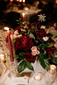 a table with candles and flowers on it