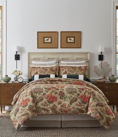 a bed in a room with two pictures on the wall above it and a dresser