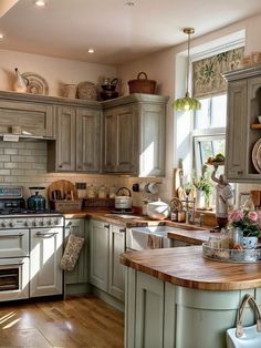 a kitchen with wooden floors and green cabinets