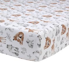 a baby crib sheet with animals on it