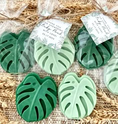 three green leaf shaped soaps sitting next to each other on top of a table