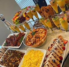 a buffet table filled with different types of food and drinks on top of each plate