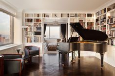 a living room filled with furniture and a grand piano