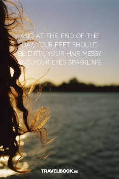 a woman's hair blowing in the wind with a quote from travelbook de