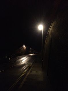 an empty street at night with no one on it