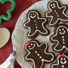 cookies decorated with icing on a white plate