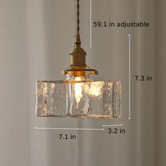 an image of a light fixture with measurements for the bulb and glass shades on it