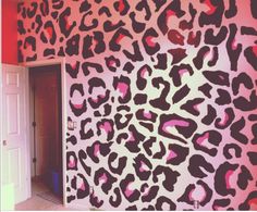 a pink and black wall with leopard print on it