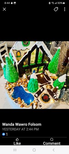 an image of a cake made to look like a house with trees and animals on it