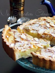 a pie with powdered sugar on top sitting on a plate