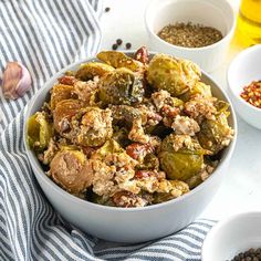 a bowl filled with brussel sprouts and other ingredients