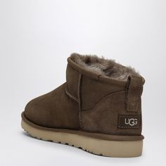 Hickory-coloured suede low boot by UGG, featuring regenerated wool lining, reversed sheepskin upper, round toe and Treadlite sole by UGG.100% Leather / Rubber sole Minu Ugg, Uggs Classic Ultra Mini, Ugg Classic Mini Chopd, Ugg Classic Ultra Mini Boots, Classic Mini Ugg Boots, Ugg Classic Ultra Mini, Low Boots, Ugg Classic, Ugg Boots