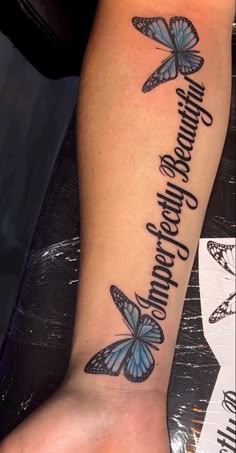 a woman's foot with butterflies on it and the words, happiness is everywhere