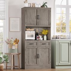 a kitchen with an oven, sink and cabinets in it's center island next to a window