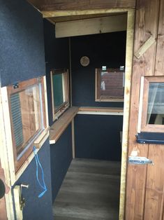 the inside of a tiny house with wood trimming