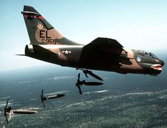 an air force jet flying through the sky next to other planes and fighter jets in flight