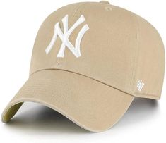 the new york yankees'47 clean cap is tan with white stitching and an embroidered ny logo