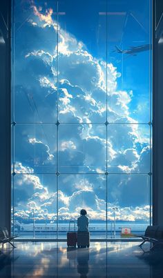 a person sitting in front of a large window with the sky and clouds reflected on it