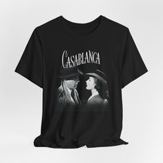 CASABLANCA Movie T shirt Shirt Old Hollywood Tee Vintage Aesthetic Tshirt Bogart Bergman  This classic unisex jersey short sleeve tee fits like a well-loved favorite. Soft cotton and quality print make users fall in love with it over and over again. These t-shirts have-ribbed knit collars to bolster shaping. The shoulders are tapered for a better fit over time. Dual side seams hold the garment's shape for longer. .: Made with 100% Airlume combed and ring-spun cotton, a lightweight fabric (4.2 oz/yd² (142 g/m that is easy to layer, breathable. Perfect for active and leisure wear.  .: The retail fit that is perfect for casual and semi-formal settings. The crew neckline adds a classic, neat style that's perfect for accessorizing. .: Bella+Canvas manufactures all its products in the US and int Casablanca Movie, Aesthetic Tshirt, Movie T Shirts, Prism Color, Vintage Aesthetic, Casablanca, Leisure Wear, Vintage Tees, Old Hollywood