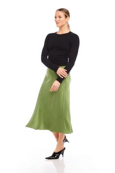 This green satin midi skirt features a sleek and sophisticated design with a flattering slit, making it perfect for any occasion. Elevate your wardrobe with the versatile and stylish Brielle Midi Skirt! Cupro Woven: 53% Cupro 47% Viscose Made in the USA of Imported Fabric Dry Clean Only Length: 31 inches (size S) Midi length Front Slit Elastic waistband Green Satin Midi Skirt, Green Midi Skirt, Satin Midi Skirt, Green Satin, Green Skirt, Midi Length, New Dress, Dress Shop, Midi Skirt