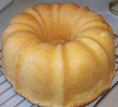 a bundt cake sitting on top of a cooling rack next to a canister