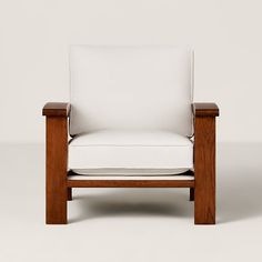 a white chair sitting on top of a wooden frame