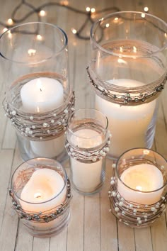 some candles are sitting on a table with lights around them and the words decorative candles for you