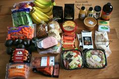 an assortment of food is laid out on a table with labels indicating the ingredients for this meal