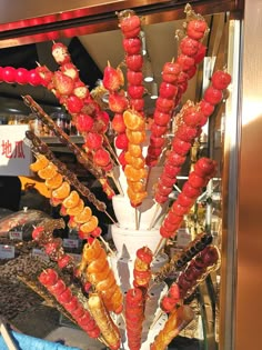 an assortment of food is displayed in a display case