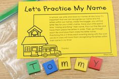 a yellow piece of paper that says, let's practice my name with blocks