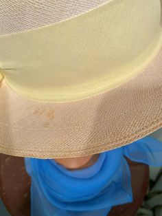 "This is a lovely vintage hat from the 70s or early 80s. No labels, only a Union tag. It measures 20.5\" around the inside. It is a tightly woven natural straw hat with a removable yellow scarf hatband & plastic flower trim. The scarf & flowers are just pinned to the hat & can easily be removed without damaging the hat. It has a short brim all around, that measures 2-1/4\" in back to 2-1/2\" in front. The hat is in good, vintage condition. It shows some pale spotting on the top of th Vintage Beige Panama Hat With Curved Brim, Vintage Beige Fedora Panama Hat, Vintage Beige Panama Hat With Short Brim, Beige Vintage Fedora Panama Hat, Vintage Beige Wide Brim Fedora, Vintage Beige Fedora With Curved Brim, Vintage Beige Fedora With Flat Brim, Vintage Beige Brimmed Fedora, Vintage Beige Top Hat With Short Brim