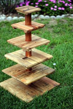 three tiered wooden stand in the grass