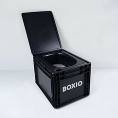 a black box sitting on top of a white table