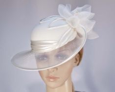 This stunning cream hat from our beautiful range of mother of the bride, evening, church and special occasion hats is hand made from combination of dull and shiny sides of luxurious fabric, fully lined and has comb for comfortable wearing. This designer fashion hat is made to order and we can make it in many colours. Just let us know the colour you like. We can also make the hat from your fabric. Please allow up to a week for the creation of the hat.  Made in Australia  Custom made to match your Wedding Hats And Fascinators, Bride Hats, Special Occasion Hats, Mother Of The Bride Hats, Hats Design, Fascinator Hats Wedding, Cream Hat, Derby Hats Fascinators, Occasion Hats