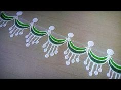 green and white paper garland on wooden table