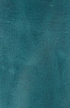 a blue leather texture background or wallpaper