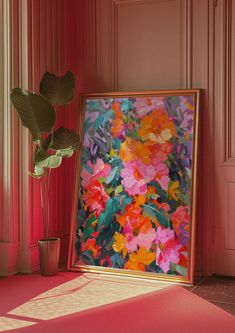 a painting is on display next to a potted plant in a room with pink walls