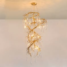 a chandelier with lights hanging from it's sides and branches in the middle