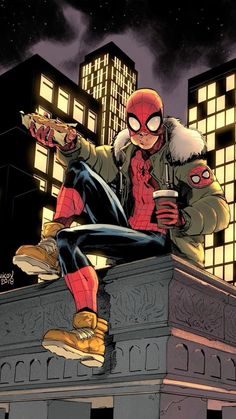 a spider - man sitting on top of a building