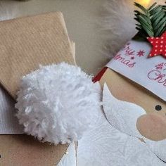 a christmas present wrapped in brown paper with a white poodle