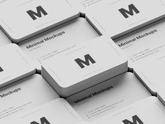 several business cards stacked on top of each other with the letter m in black and white