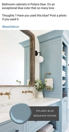 a bathroom with blue cabinets and white counter tops is featured in the instagramt