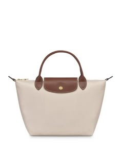 In a miniature size, Longchamp's signature nylon tote lends sophisticated style to every look. The lightweight design folds up for ease during travel. Longchamp Colors, Business Fits, Longchamp Bag, Top Handle Handbags, Nylon Tote, Different Outfits, Christmas Wishlist, Longchamp Le Pliage, Sophisticated Style