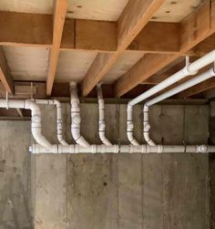 the inside of a building with pipes running from it to the ceiling and on top of each other