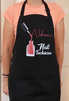 a woman wearing an apron with a bottle of nail polish on it