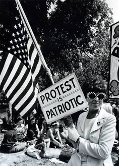 an old photo of people holding protest signs