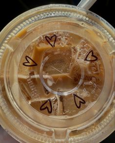 a close up of a plastic container with some food in it and writing on the lid