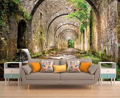 a living room scene with an arch in the wall and a couch on the floor