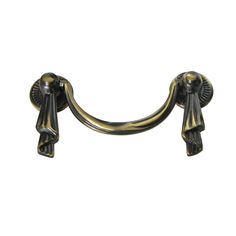 an antique brass door handle on a white background